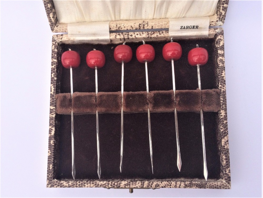 A jazz age set of six silver cocktail sticks.