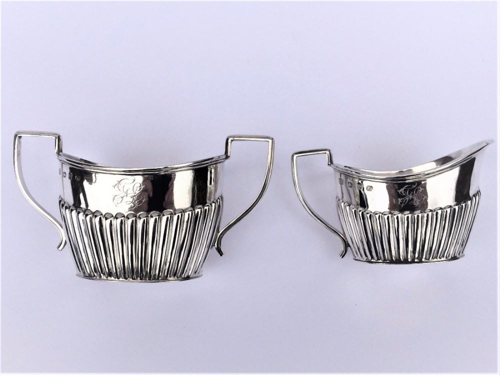 A fine Victorian silver cream jug and sugar bowl.