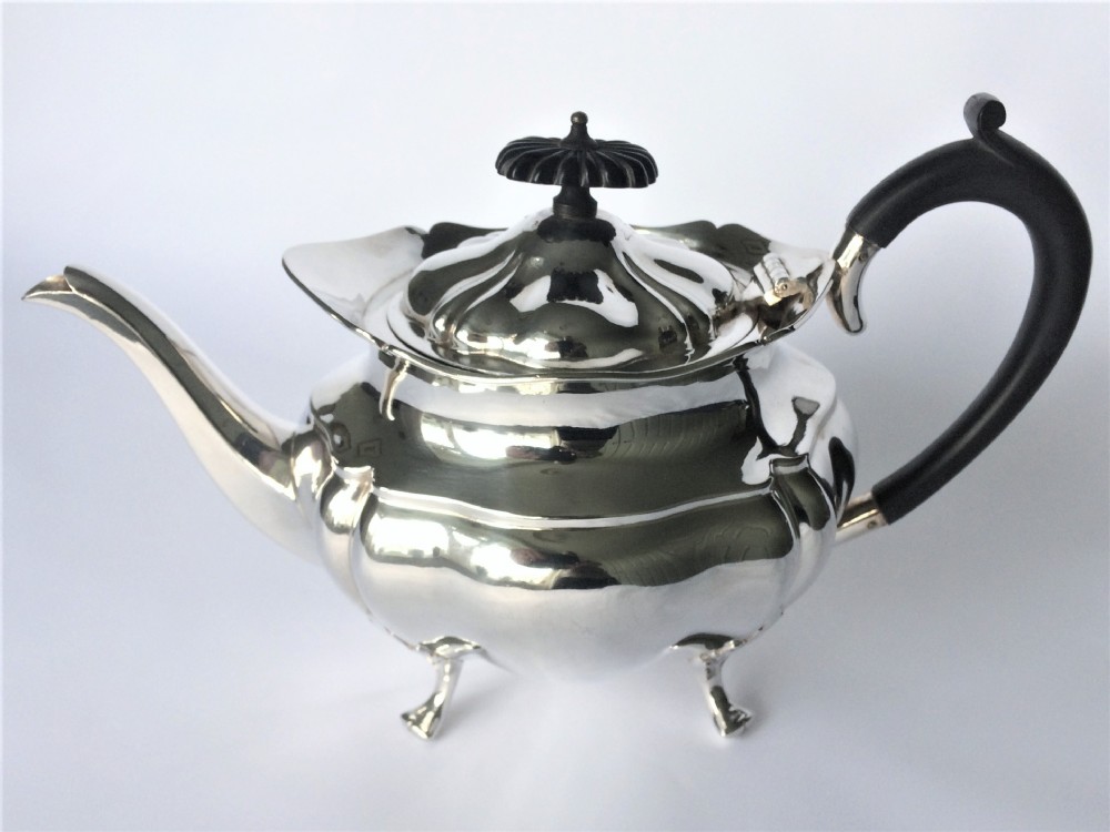 A handsome family size silver teapot. 