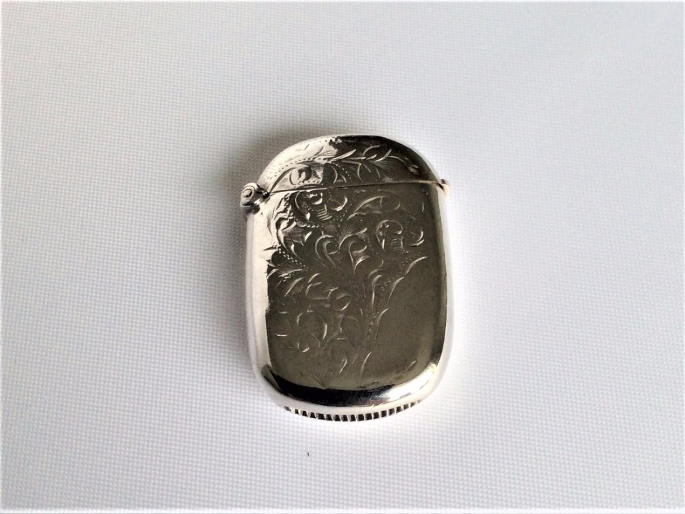 An oval shaped Edwardian silver vesta.