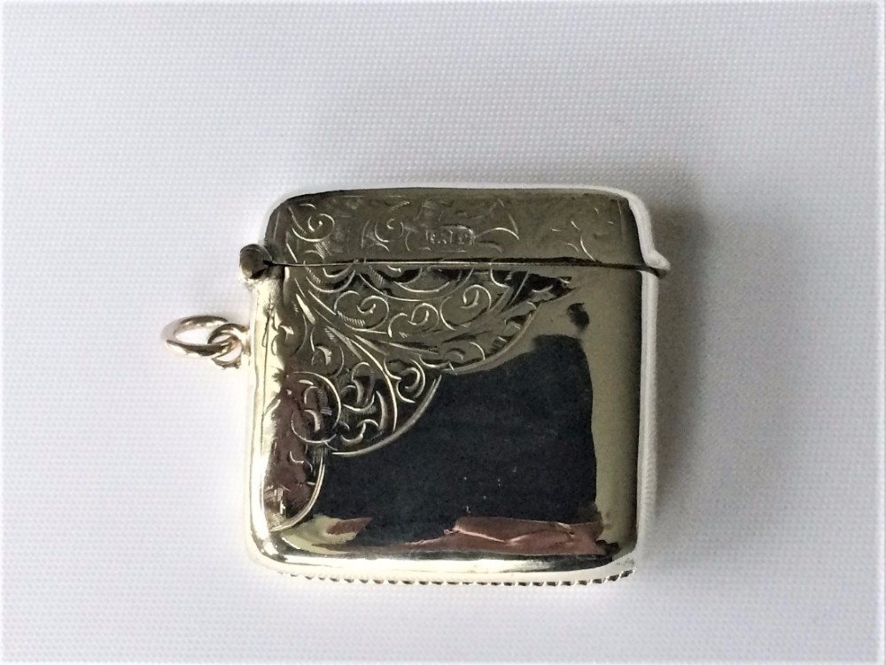 A charming square Edwardian silver vesta.