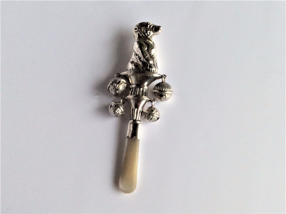 A delightful Edwardian silver 'dog' motif rattle.