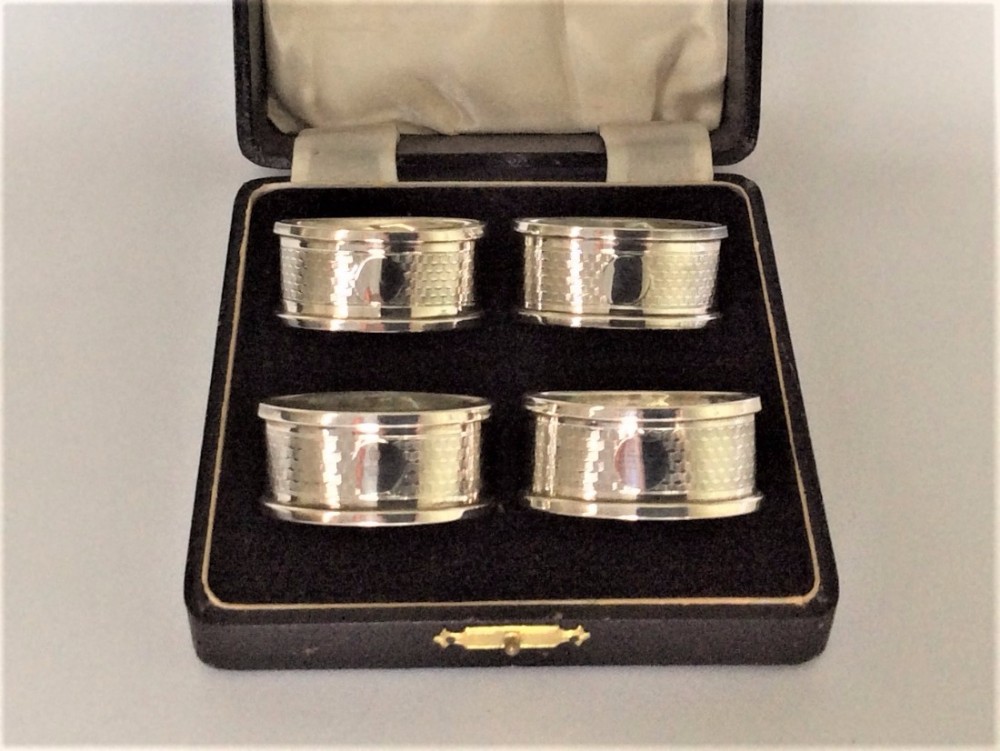 An Art Deco set of boxed silver napkin rings.