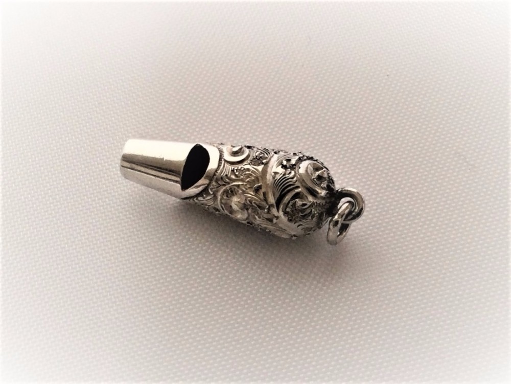 A charming Victorian silver dog whistle.