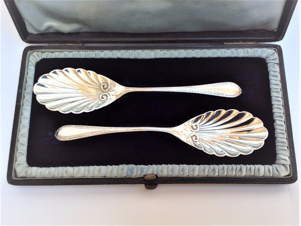 A pair of Victorian silver boxed jam and marmalade spoons.