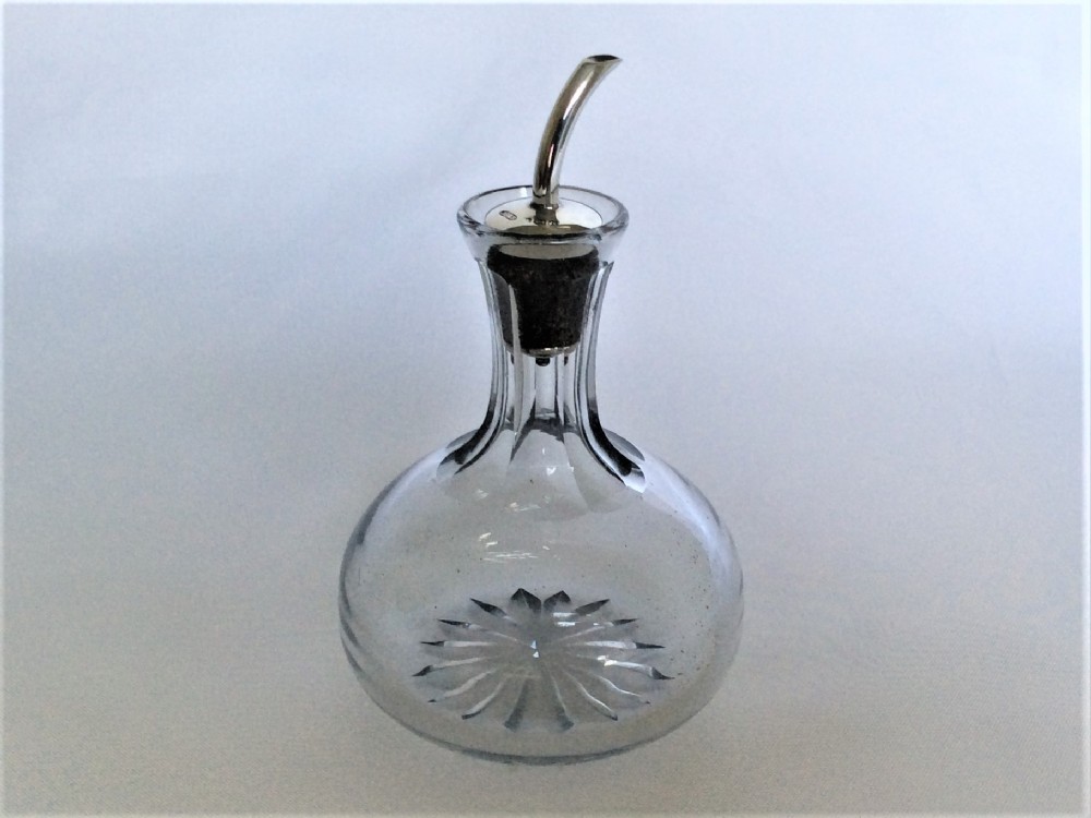 A lovely silver mounted angostura bitters jigger.