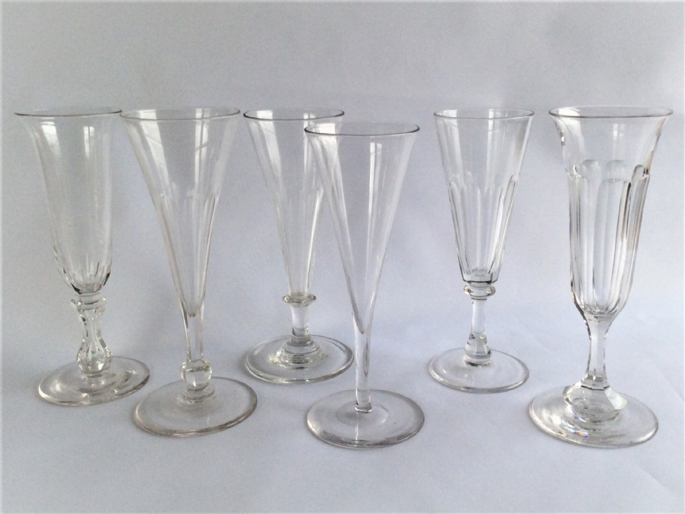 A Victorian harlequin set of six cut champagne flutes.