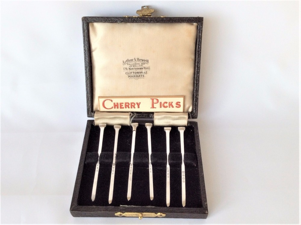 A lovely set of novelty silver 'hob nail' cocktail sticks.