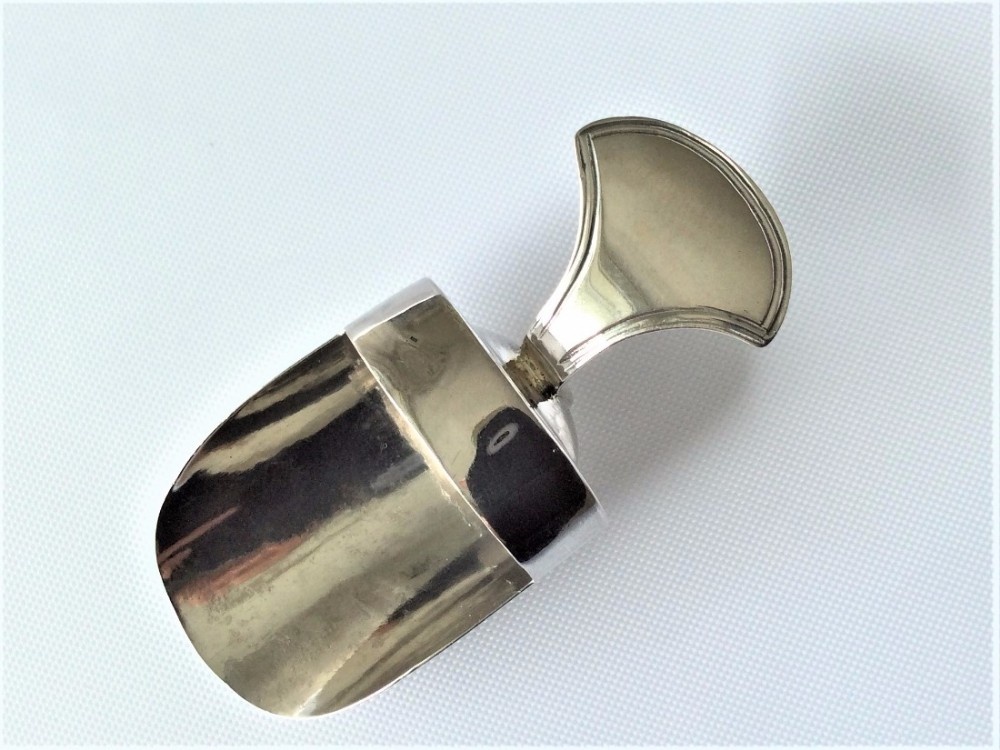An unusual Georgian silver novelty caddy spoon.