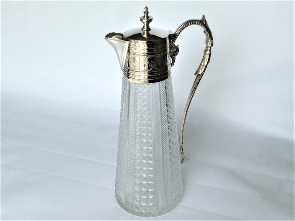 A superb mid-Victorian claret jug with silver plated mount.