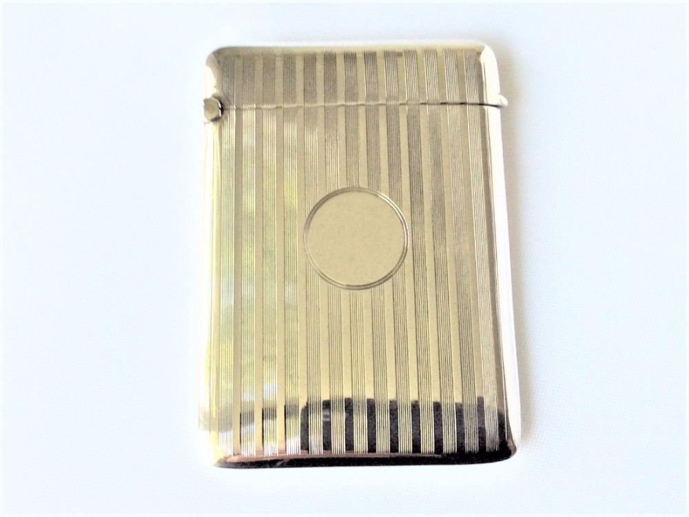 A stylish engine turned silver card case.