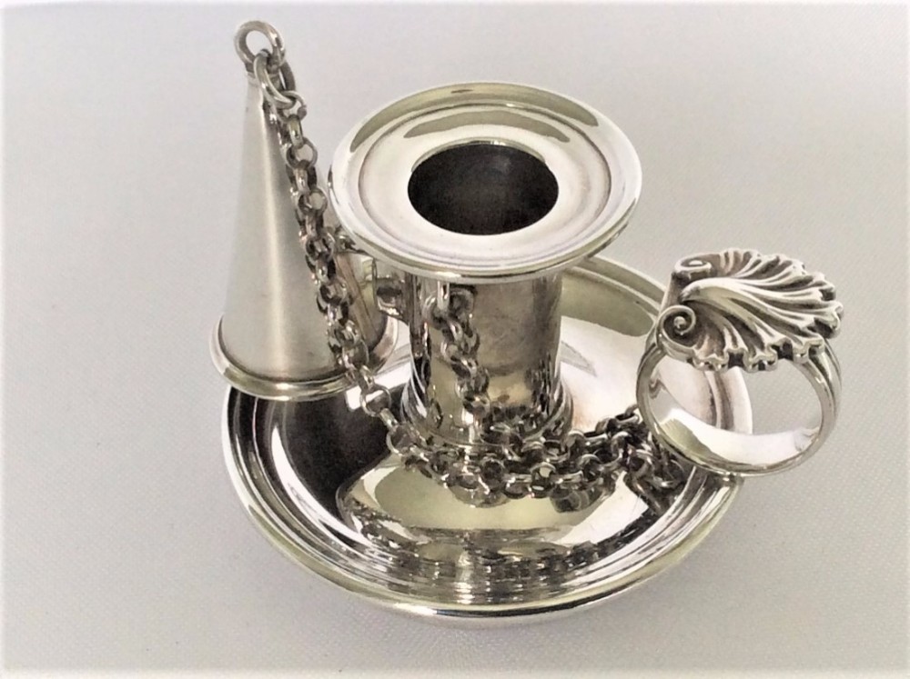 A rare Victorian silver go-to-bed with snuffer.