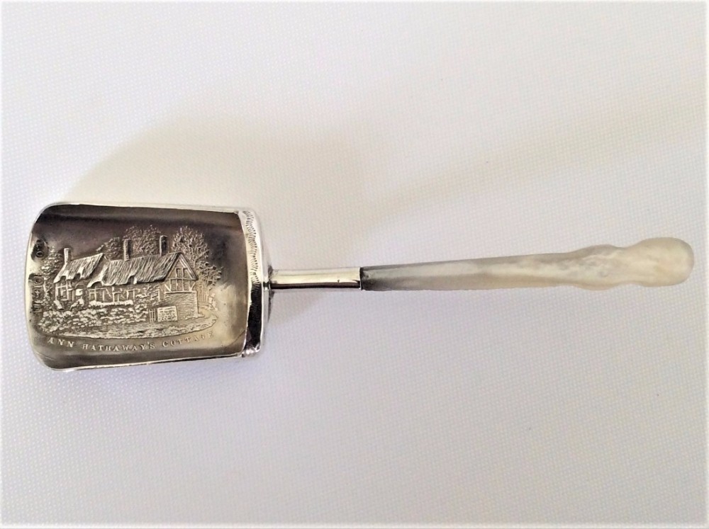 A rare 'Ann Hathaway's cottage' silver caddy shovel.