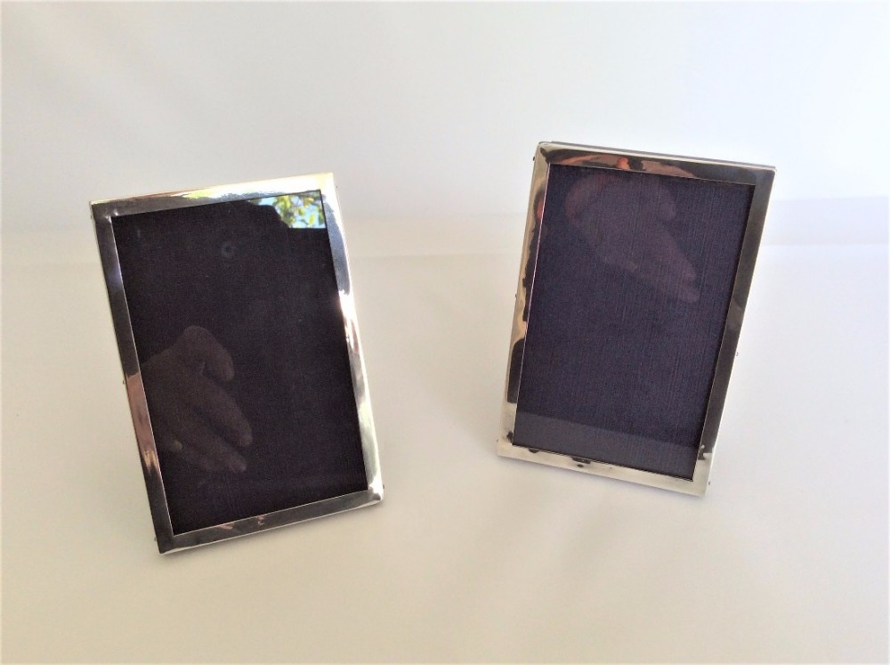 A good pair of matching silver photo frames.