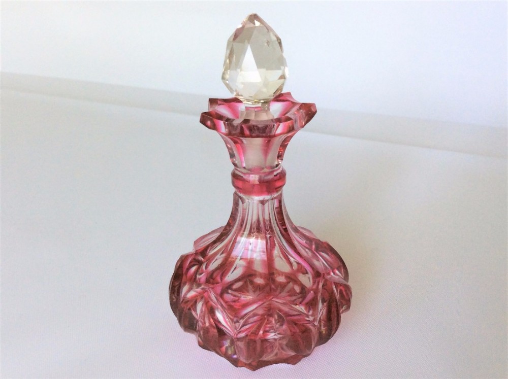  A charming Victorian gothic cranberry scent bottle.