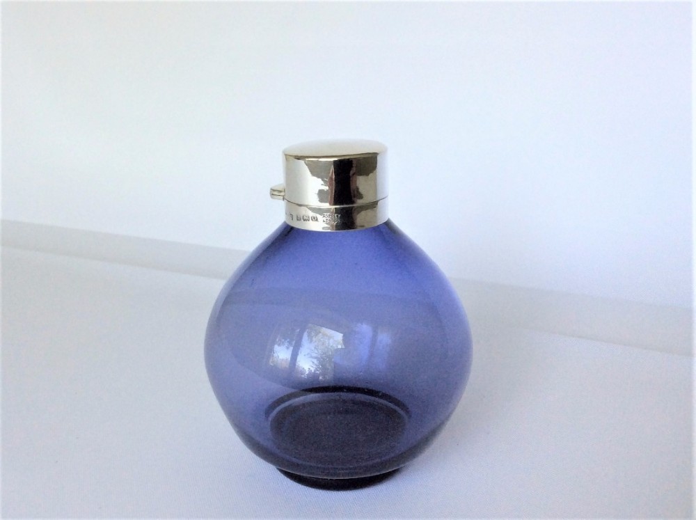  A stunning silver mounted Asprey's cologne bottle.