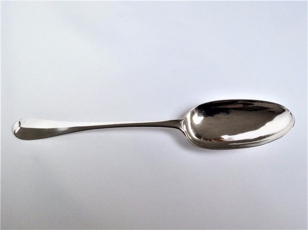 A superb George I Britannia Standard silver serving spoon.