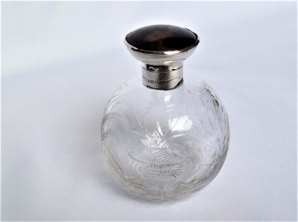 An Aesthetic movement silver & tortoiseshell cologne bottle.