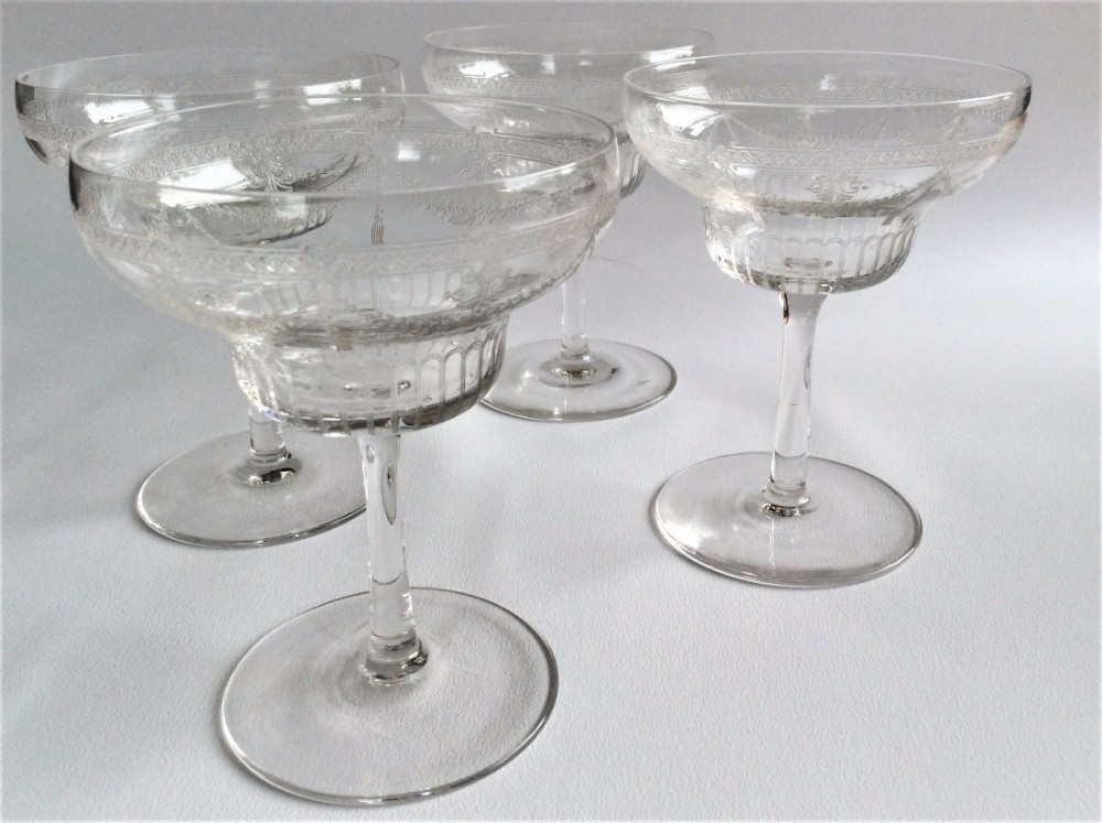 A delightful set of four Edwardian champagne glasses.