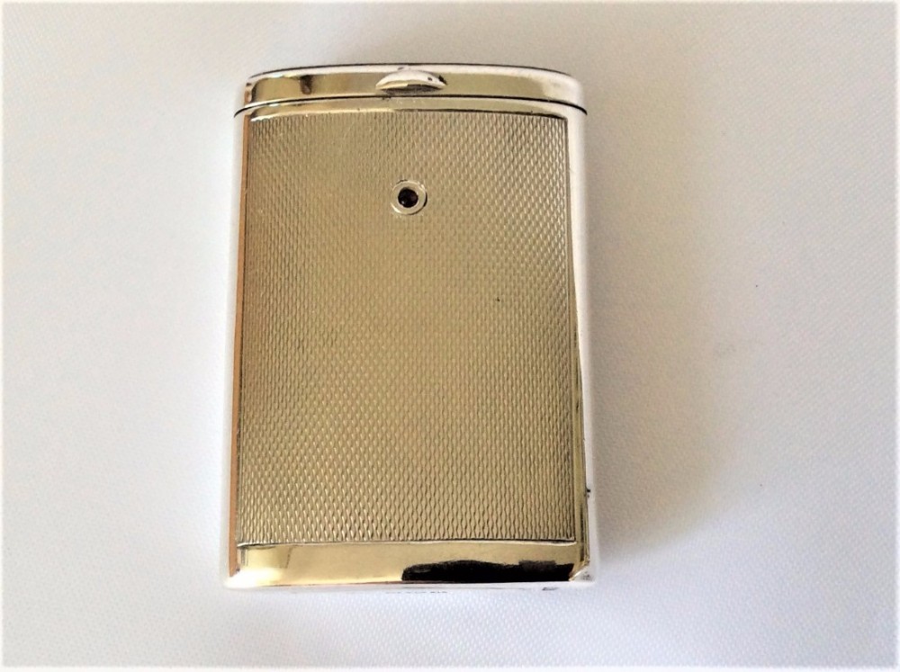 A fabulous Art Deco sliding silver vesta with garnet.