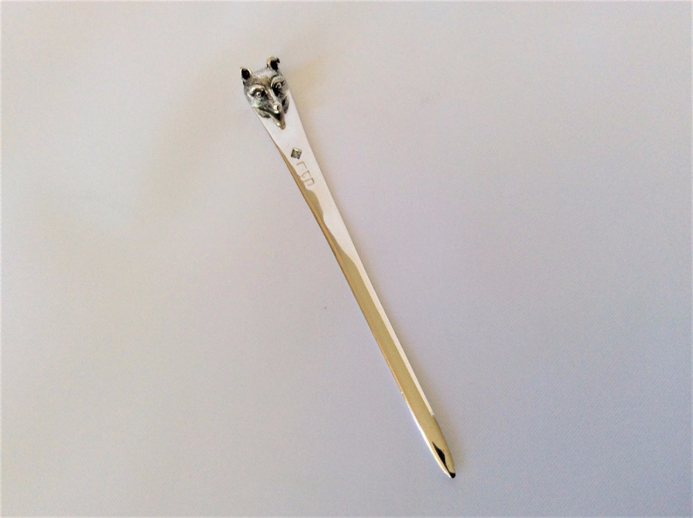 A rare silver fox head bookmark/letter opener.