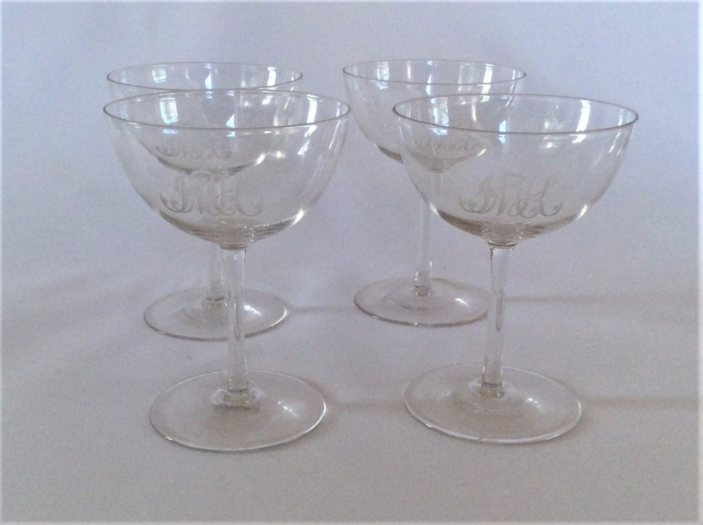 A stylish set of four engraved champagne glasses.