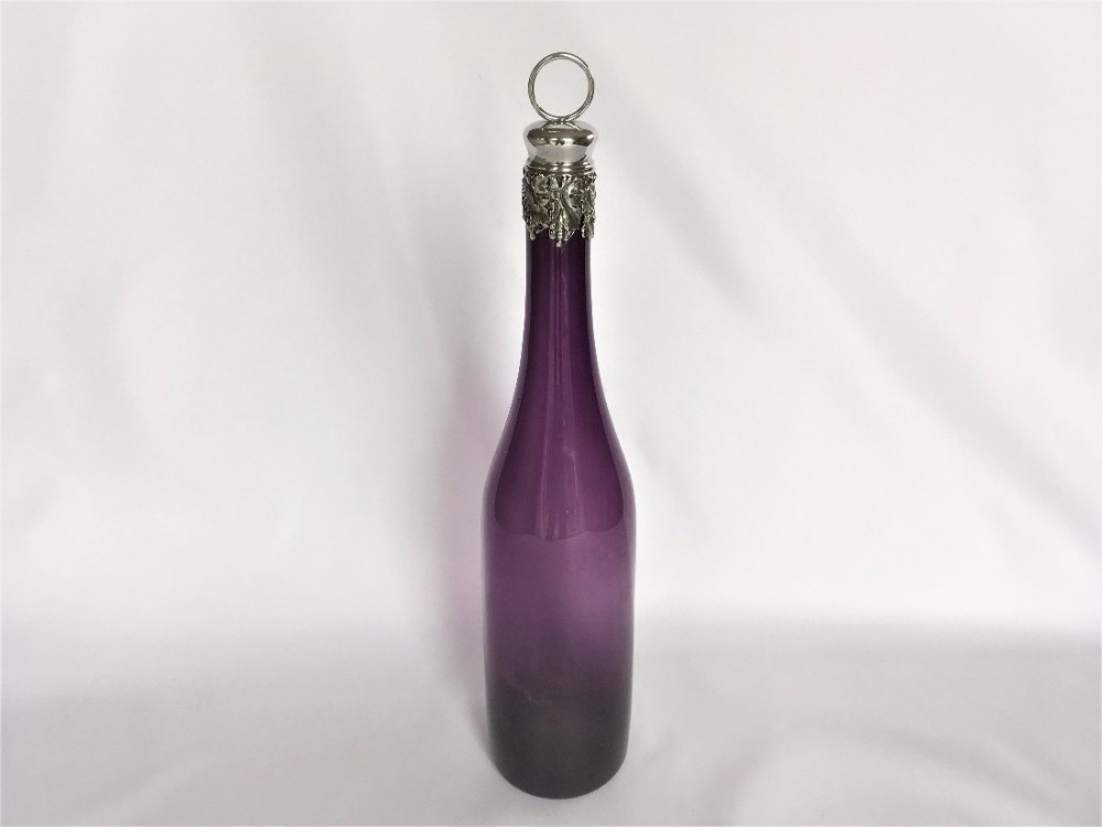 A stunning silver mounted amethyst wine decanter.