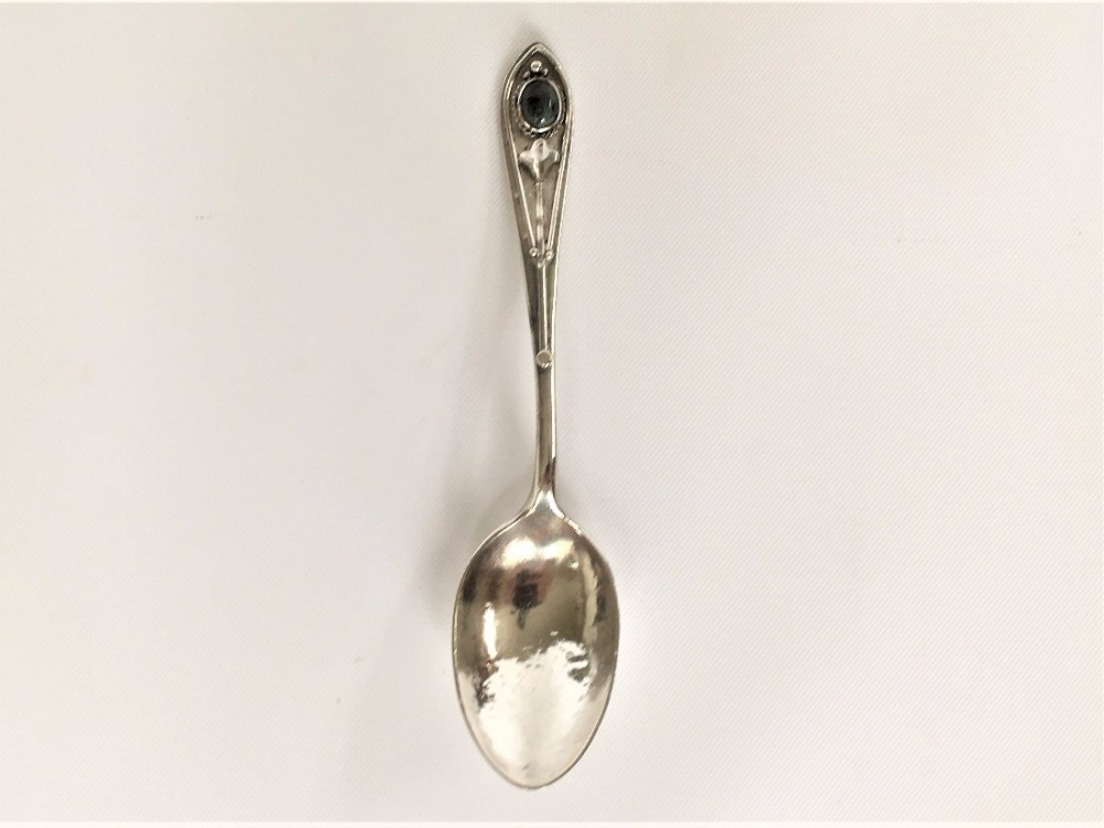 A rare Female silversmith Arts & Crafts silver spoon.