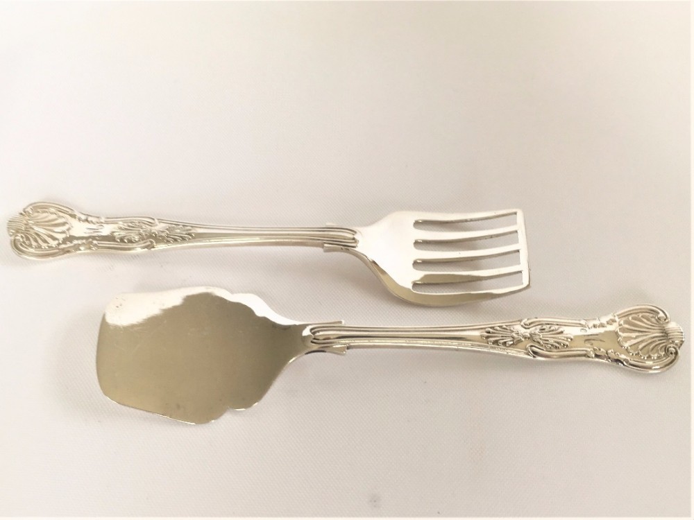 A pair of Kings pattern silver sardine servers.