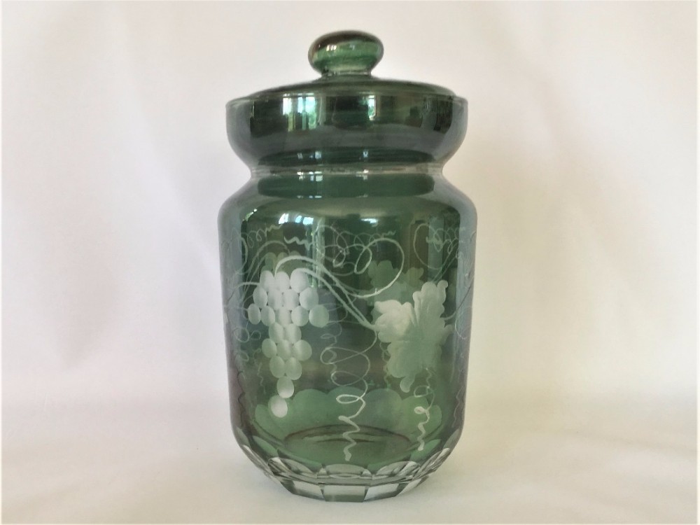 A small late Victorian green glass biscuit barrel.