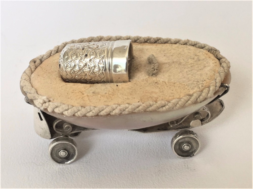 A rare Edwardian novelty silver roller skate thimble holder. View II