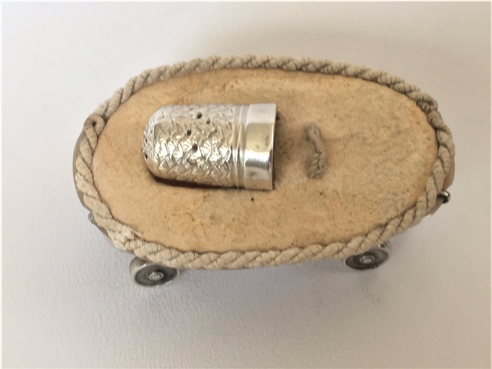 A rare Edwardian novelty silver roller skate thimble holder. View III