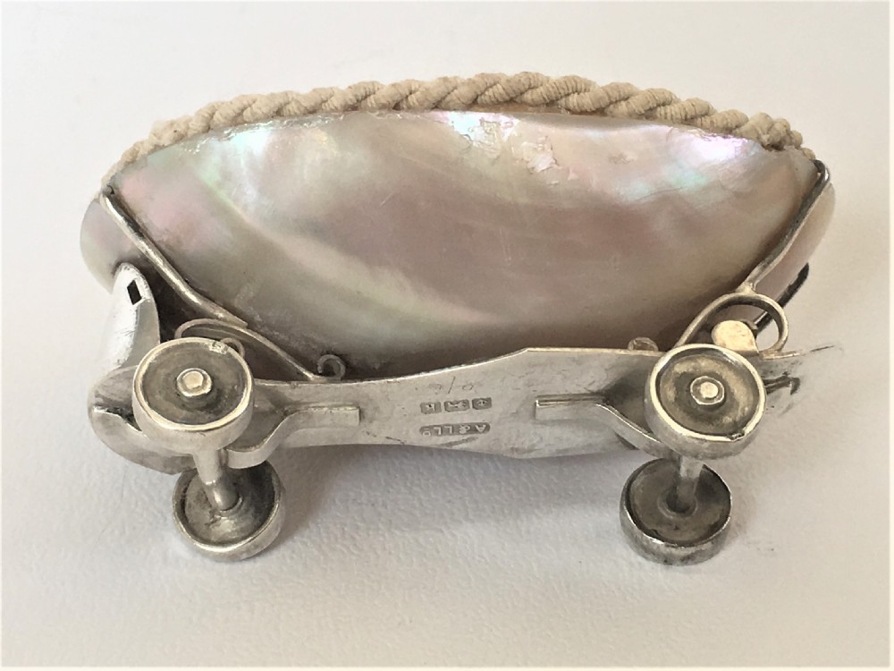 A rare Edwardian novelty silver roller skate thimble holder. View IV