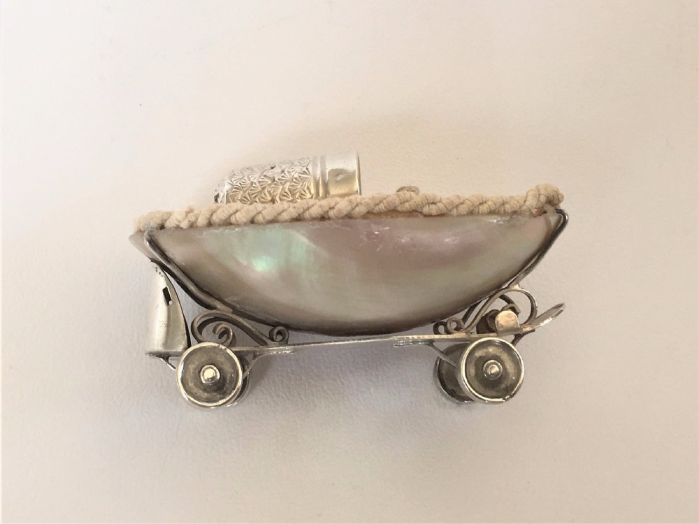 A rare Edwardian novelty silver roller skate thimble holder. View VI
