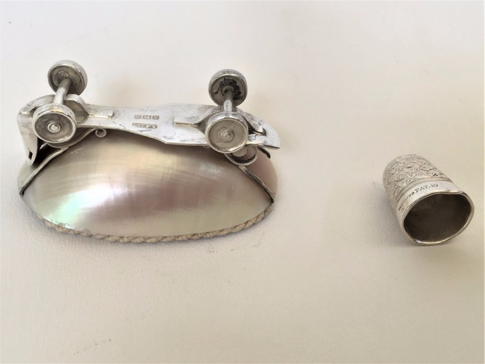 A rare Edwardian novelty silver roller skate thimble holder. View VII