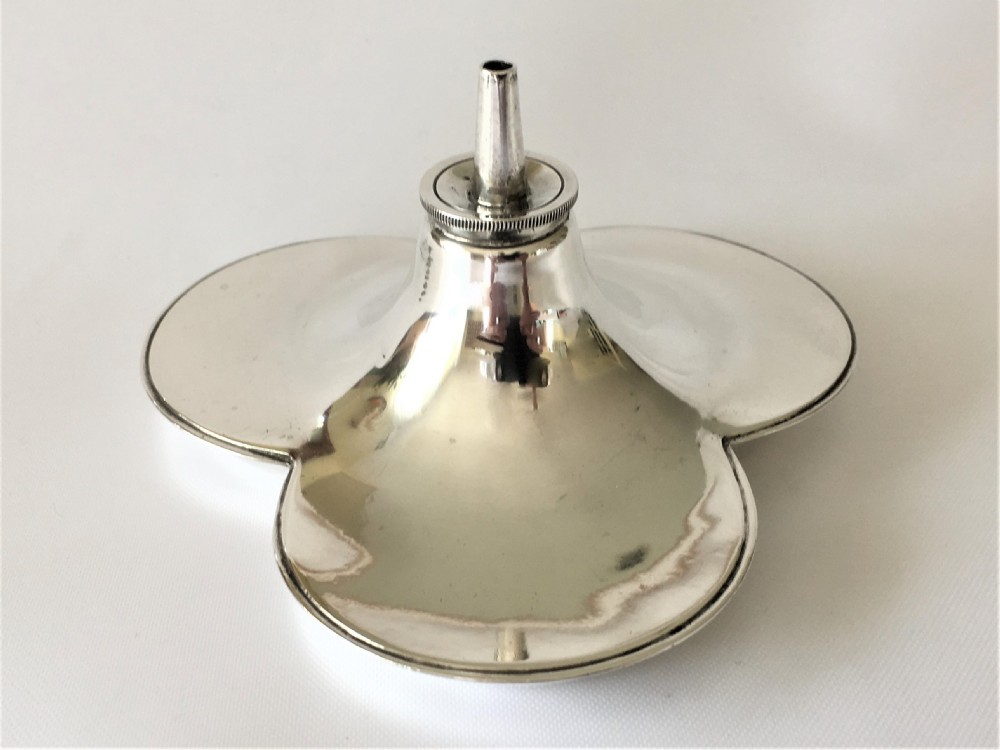 An unusual silver trefoil table lighter.