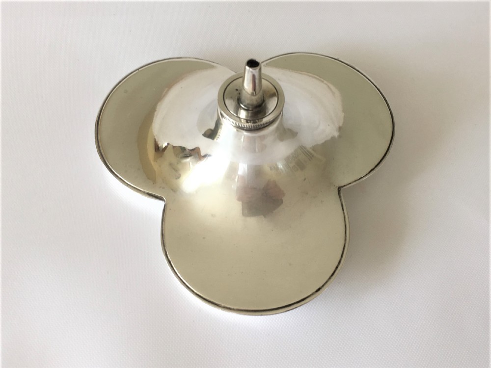 An unusual silver trefoil table lighter. View III