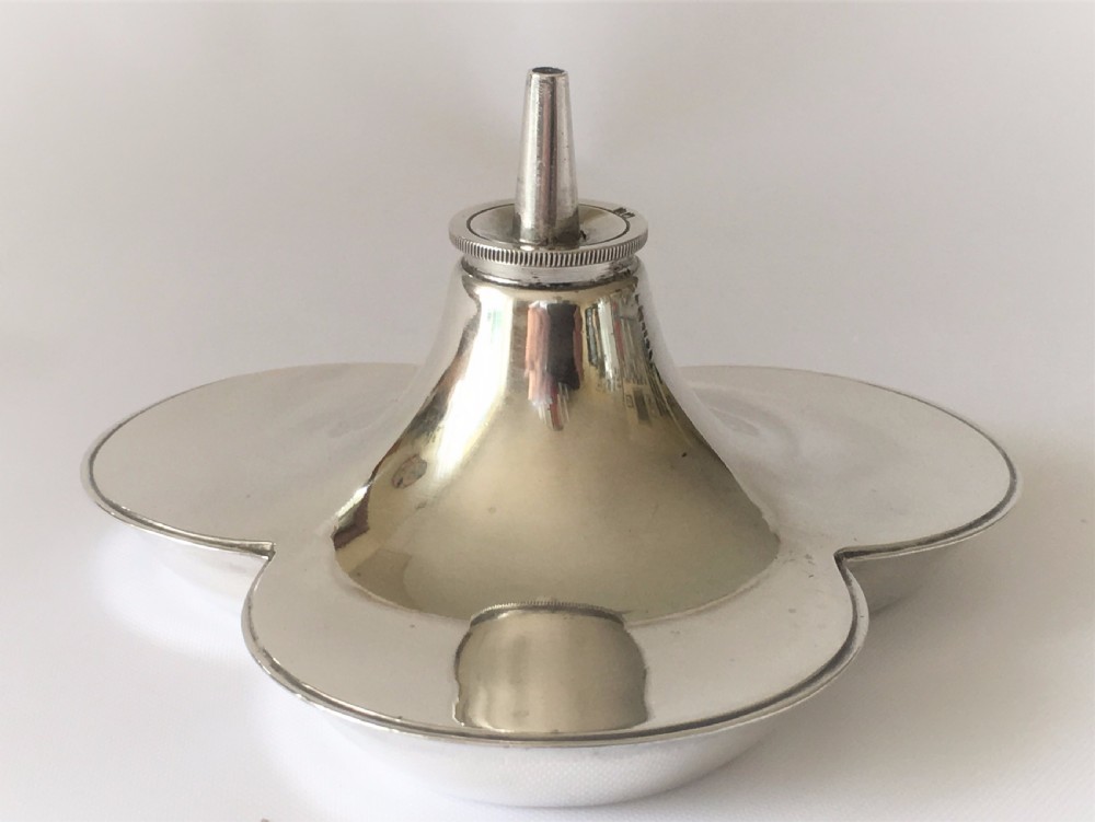 An unusual silver trefoil table lighter. View VI