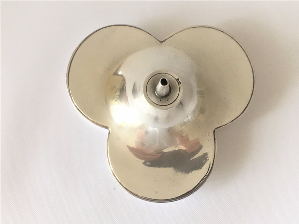 An unusual silver trefoil table lighter. View VII