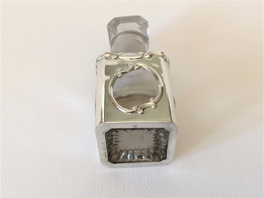 A delightful Art Nouveau silver cased scent bottle. View V