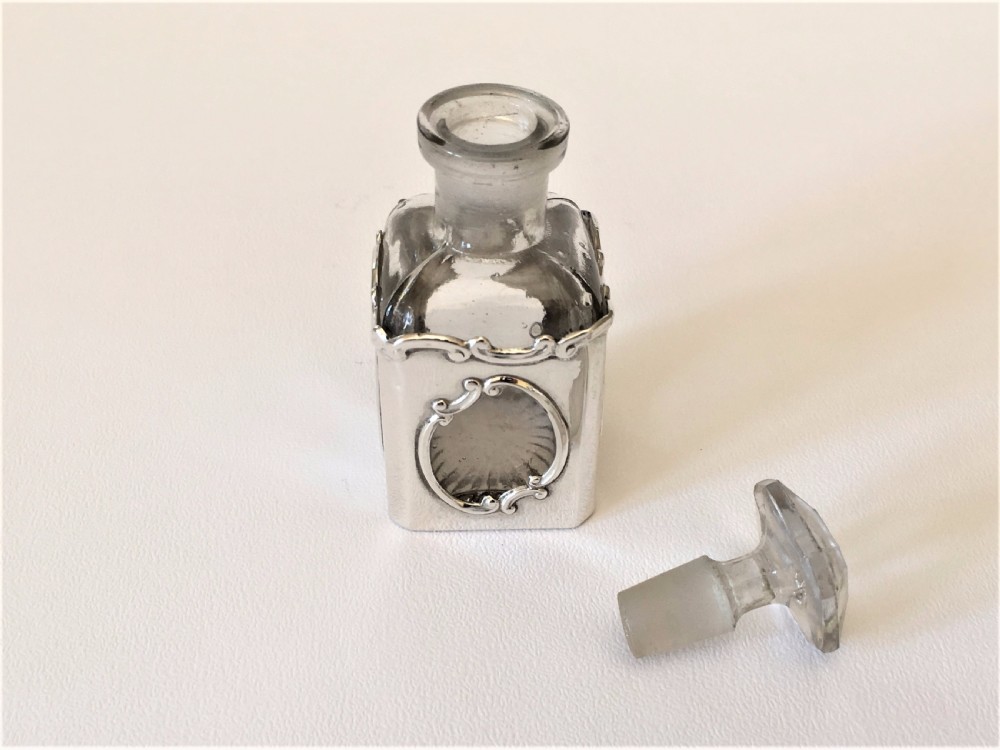 A delightful Art Nouveau silver cased scent bottle. View VII