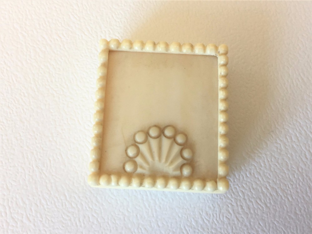 A Victorian carved ivory stamp case. View III