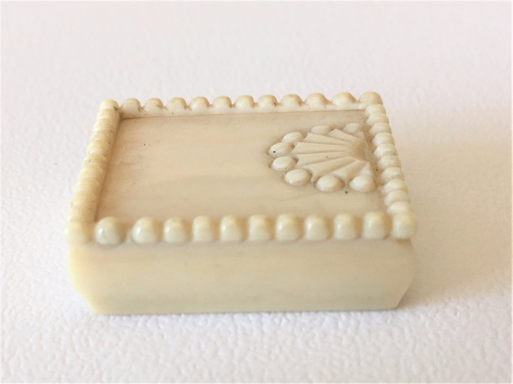 A Victorian carved ivory stamp case. View IV