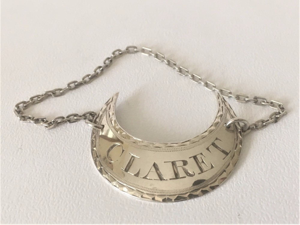 An 18th Century Sheffield silver Claret Label.