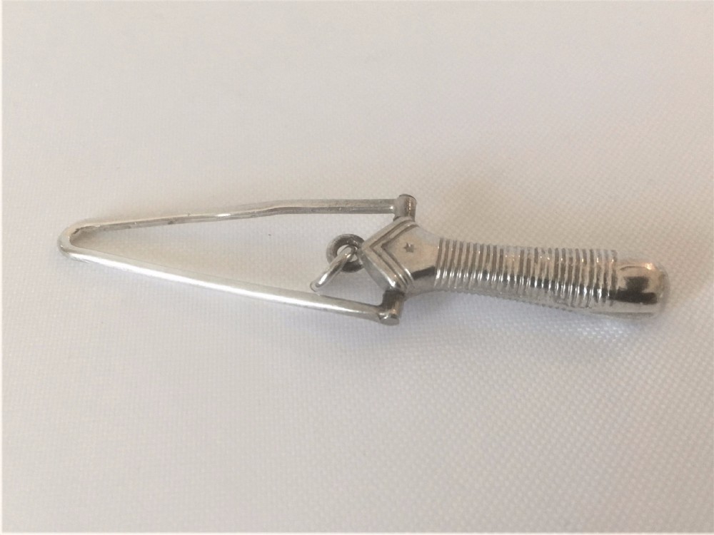 A Victorian silver ribbon threader. View II