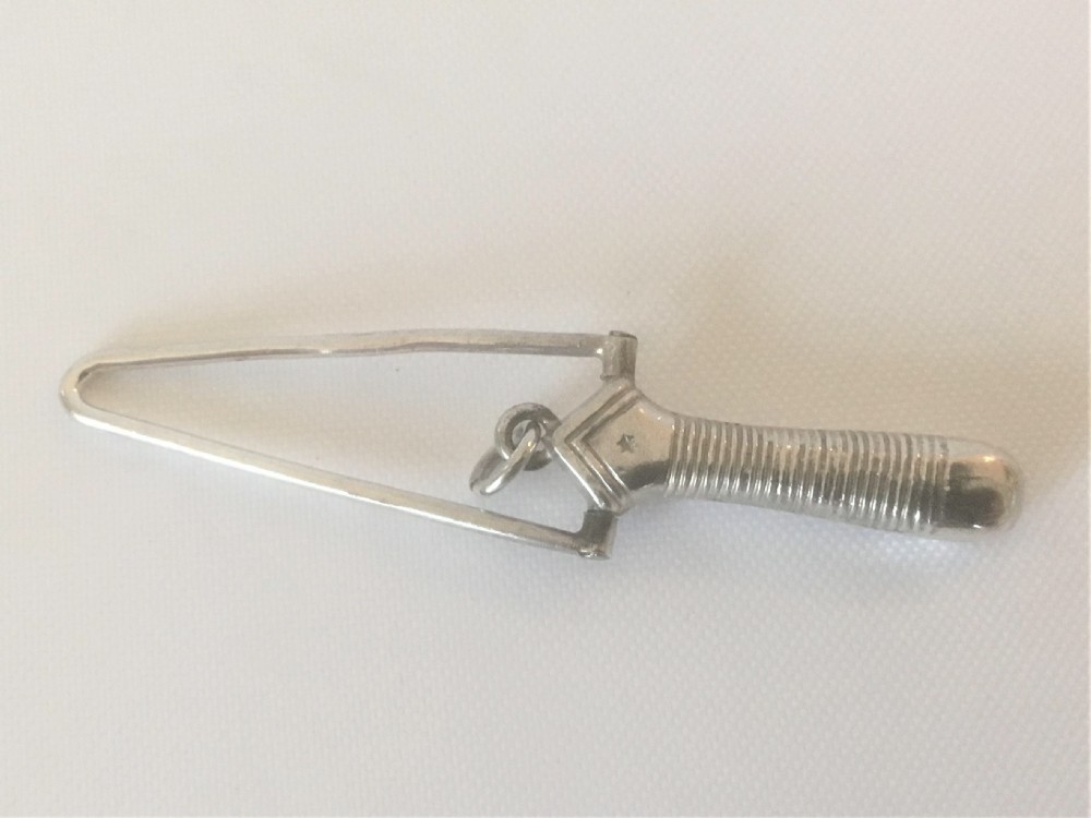 A Victorian silver ribbon threader. View IV