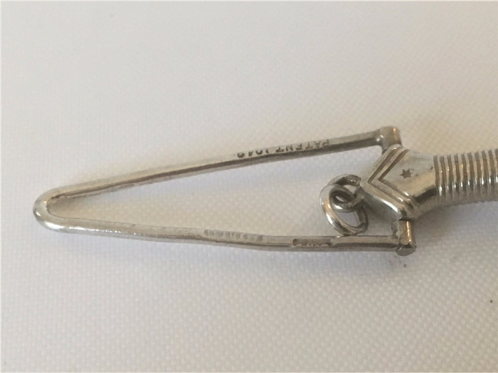 A Victorian silver ribbon threader. View V