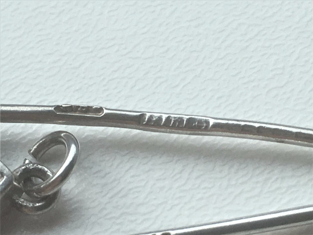 A Victorian silver ribbon threader. View VIII