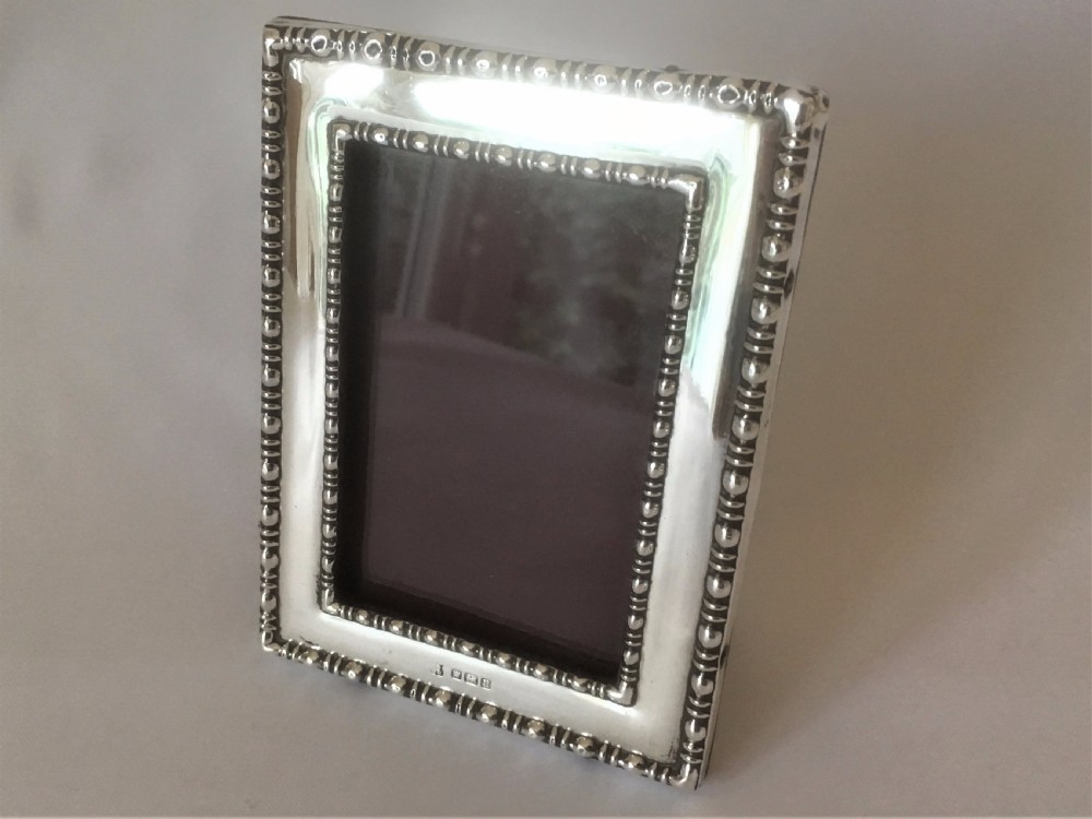 A charming small silver photo frame. View IV