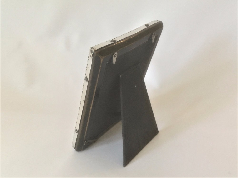 A charming small silver photo frame. View V